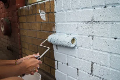 Brick being painted white
