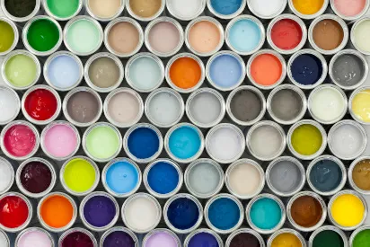 a bunch of cans of different colored paints